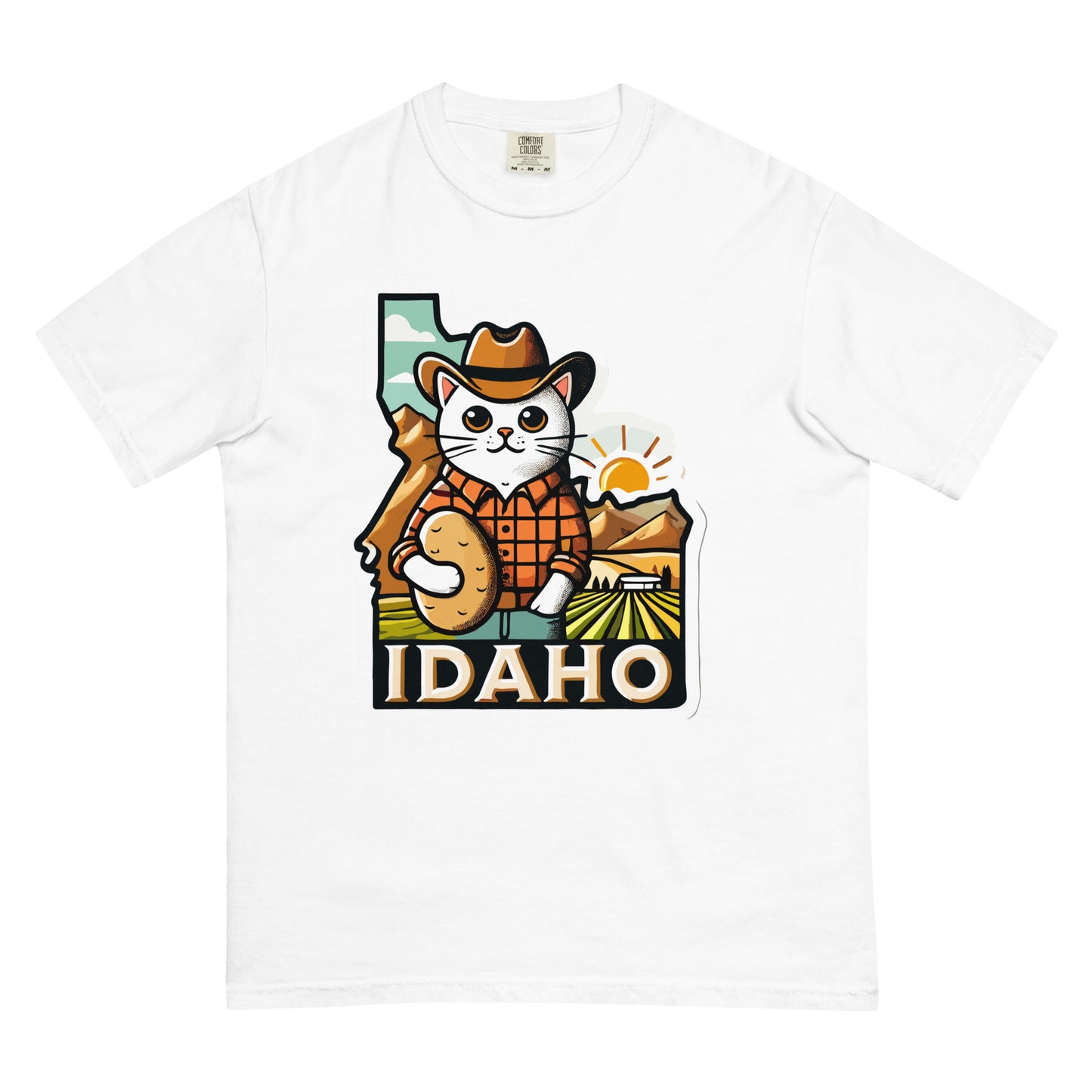 White Idaho cat shirt featuring a cartoon cat in cowboy attire holding a potato with Idaho landscape background