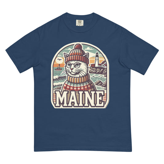 Navy blue Maine cat t-shirt featuring a cat in a knit hat and sweater with a lighthouse background