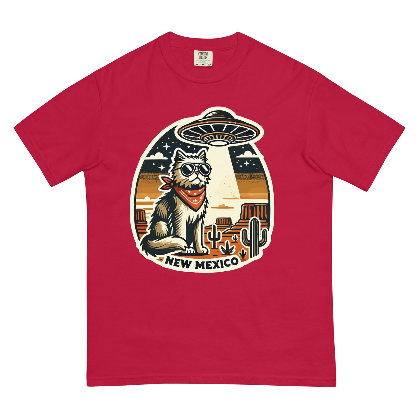 Red New Mexico cat t-shirt featuring a cool cat with sunglasses and a bandana under a UFO in desert scenery