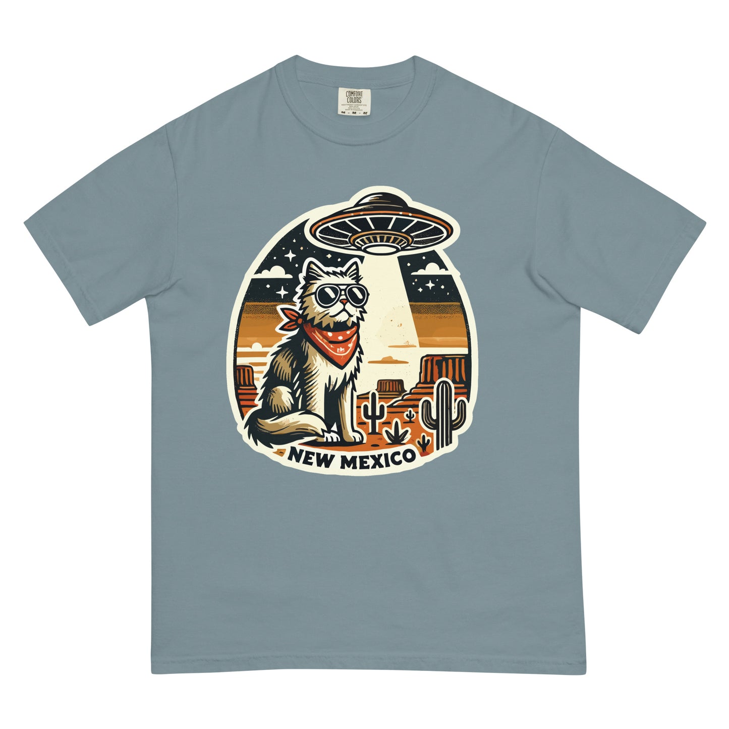 New Mexico cat t-shirt featuring a cool cat with sunglasses and bandana under a UFO in desert scenery