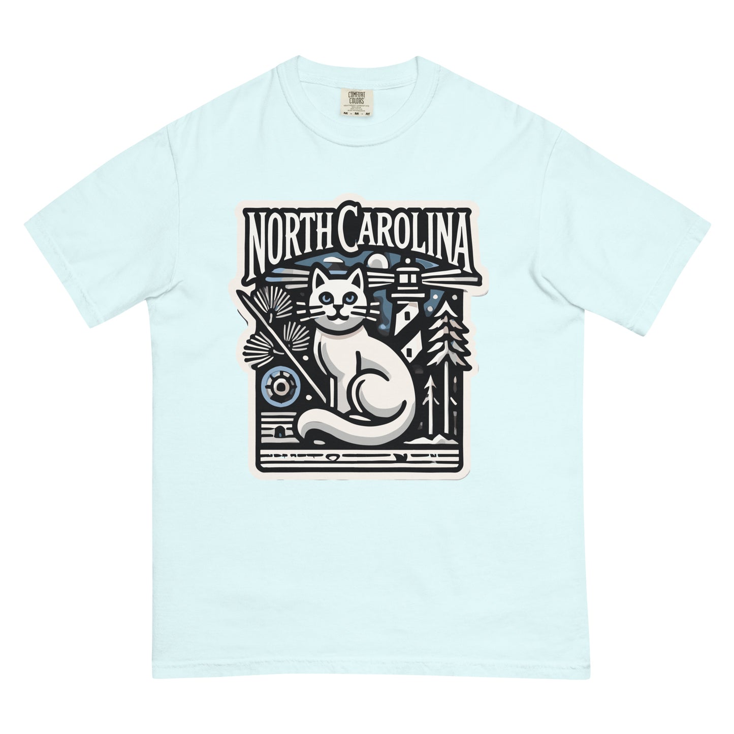 Light blue North Carolina cat shirt featuring a graphic cat with pine trees and a lighthouse