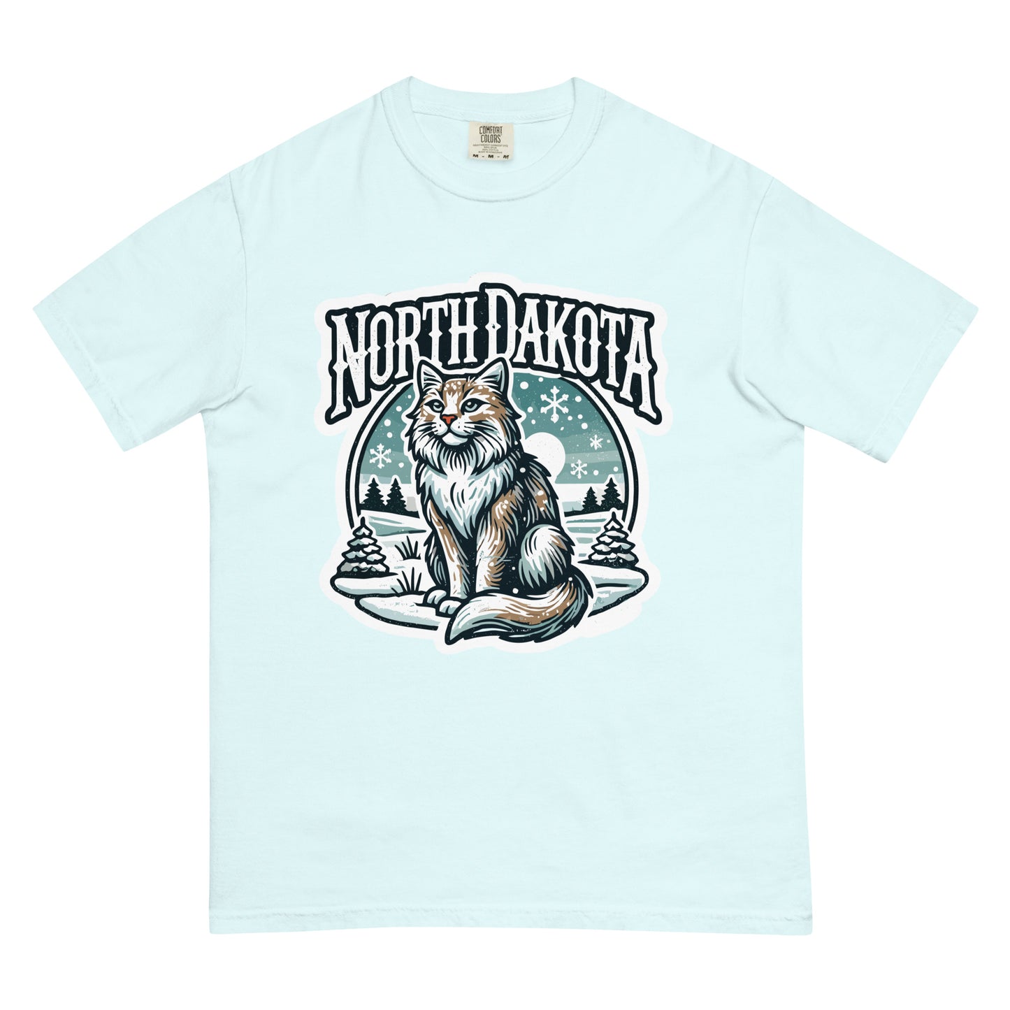 Light blue North Dakota cat t-shirt featuring a detailed cat illustration with winter trees and snowflakes