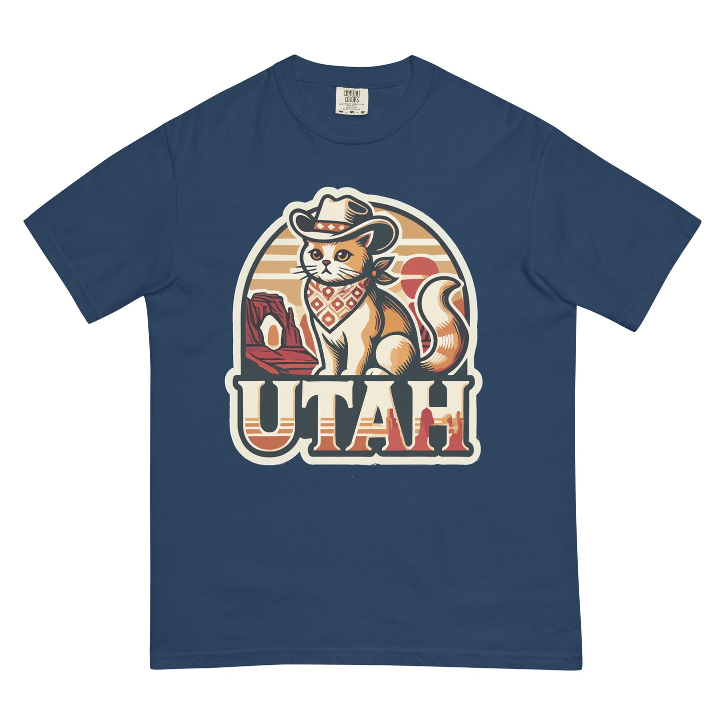 Blue Utah cat t-shirt featuring a cartoon cat in a cowboy hat and bandana with Utah landscape background