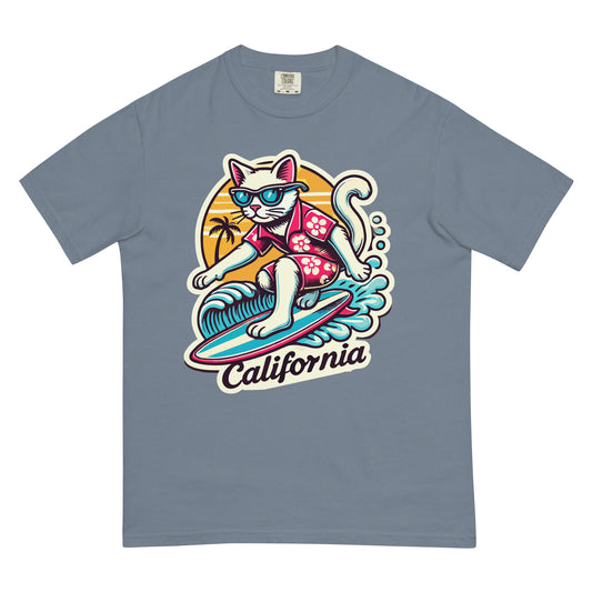 California cat t-shirt featuring a surfing cat wearing sunglasses and a Hawaiian shirt on a blue tee