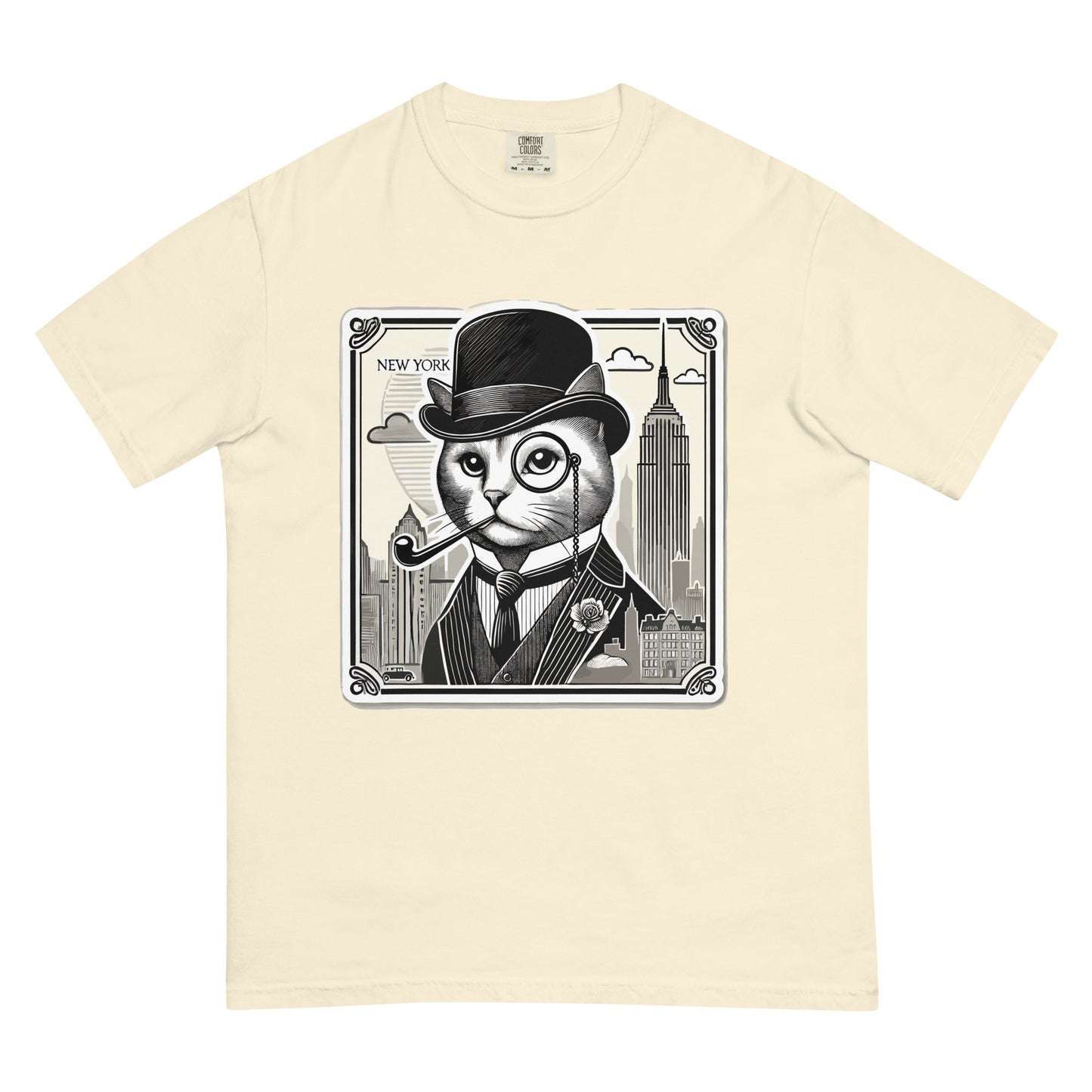 Beige New York cat shirt featuring a stylish cat in a suit with a pipe and bowler hat in front of city skyline