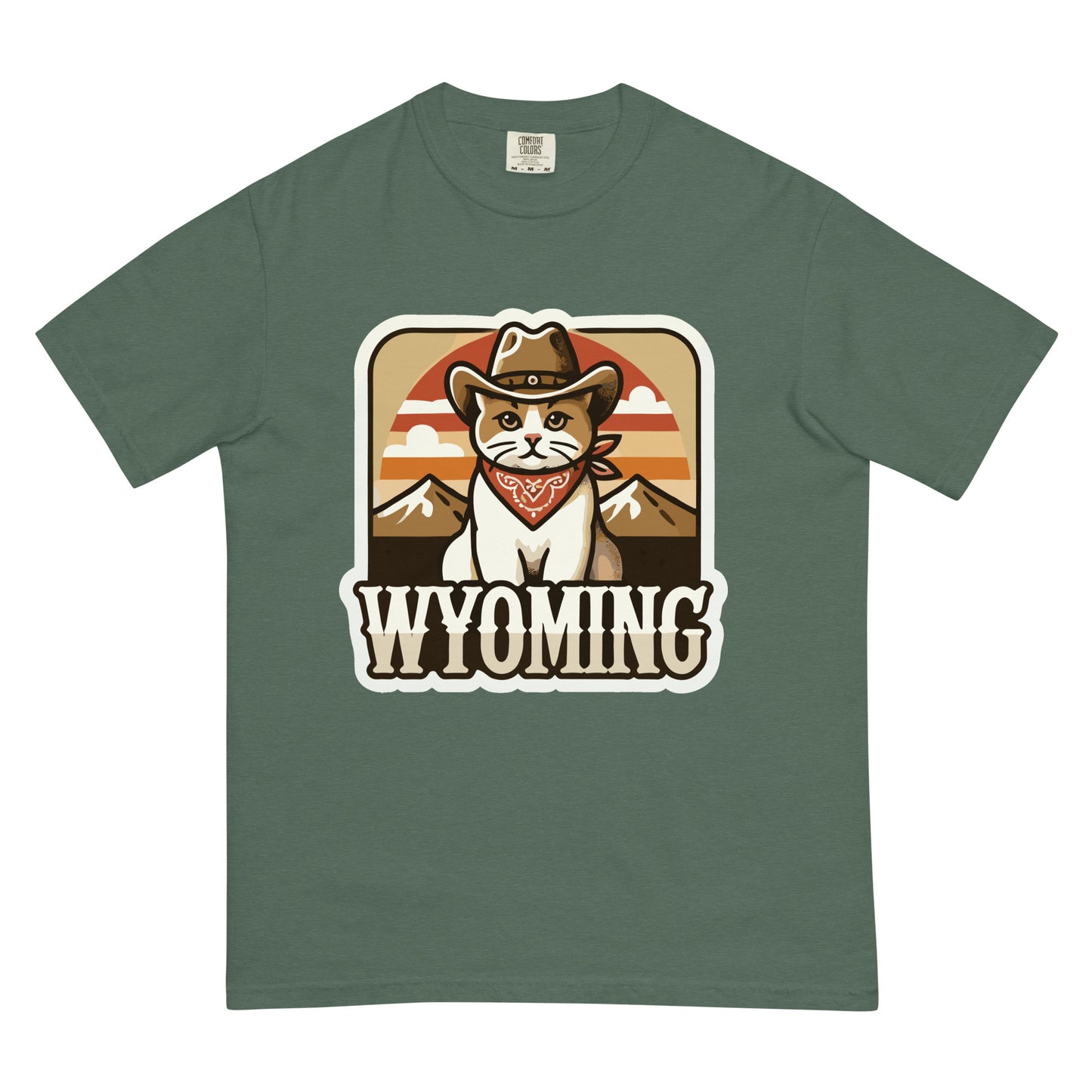 Green Wyoming cat t-shirt featuring a cat wearing a cowboy hat and bandana with mountain background