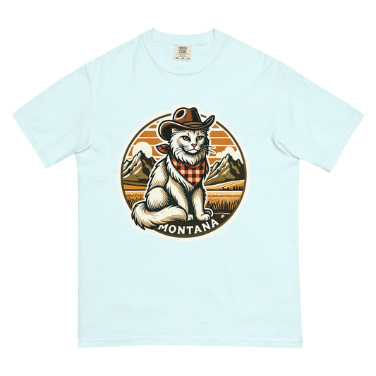 Light blue Montana cat t-shirt featuring a cowboy cat with mountains and sunset background