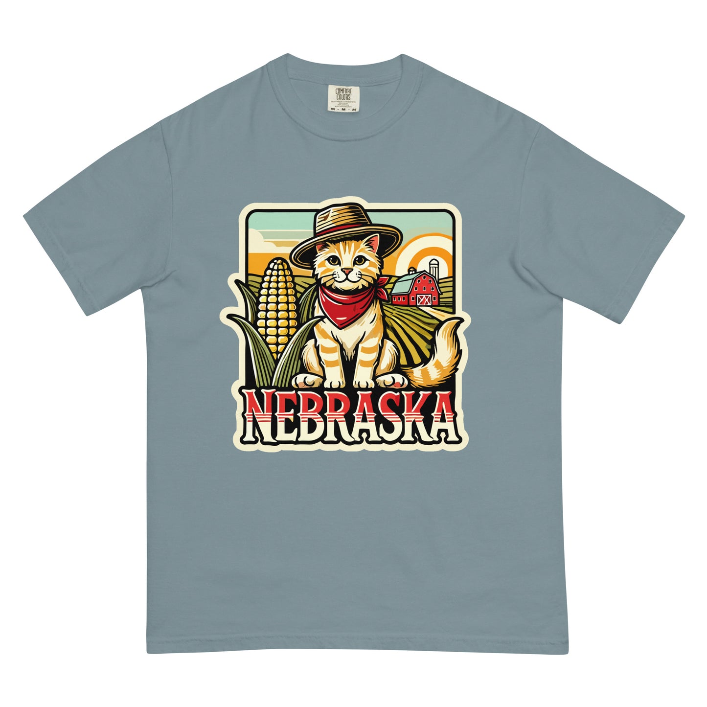 Nebraska cat t-shirt featuring a cat with a hat and bandana in a farm setting with corn and barn