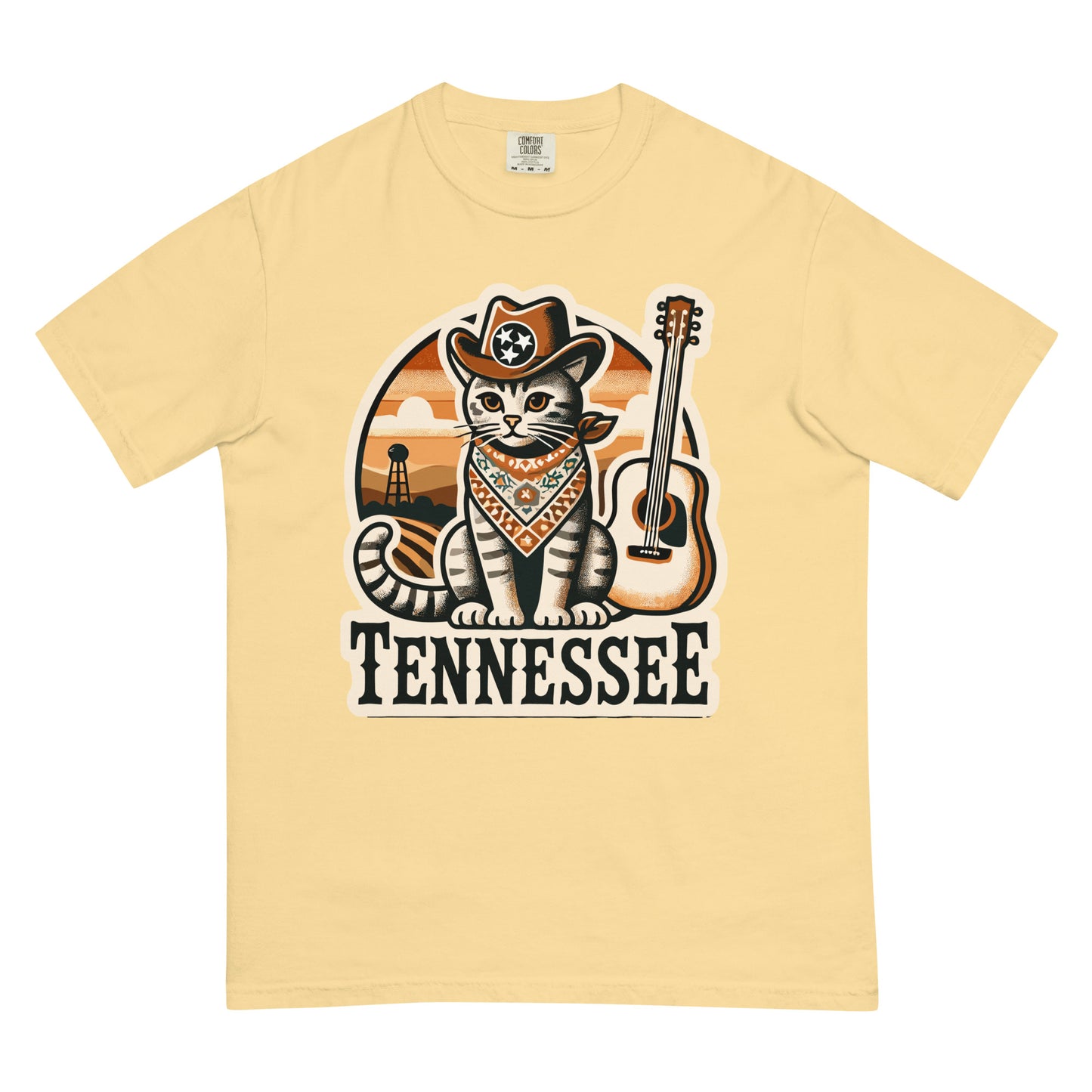 Tennessee cat shirt with cartoon cat in cowboy hat and bandana next to guitar on beige tee