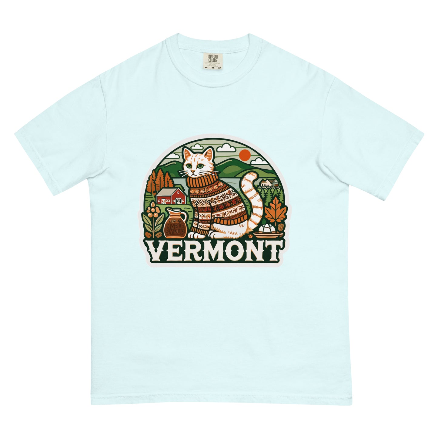 Light blue Vermont cat t-shirt with a graphic of a cat in a sweater and scenic Vermont background