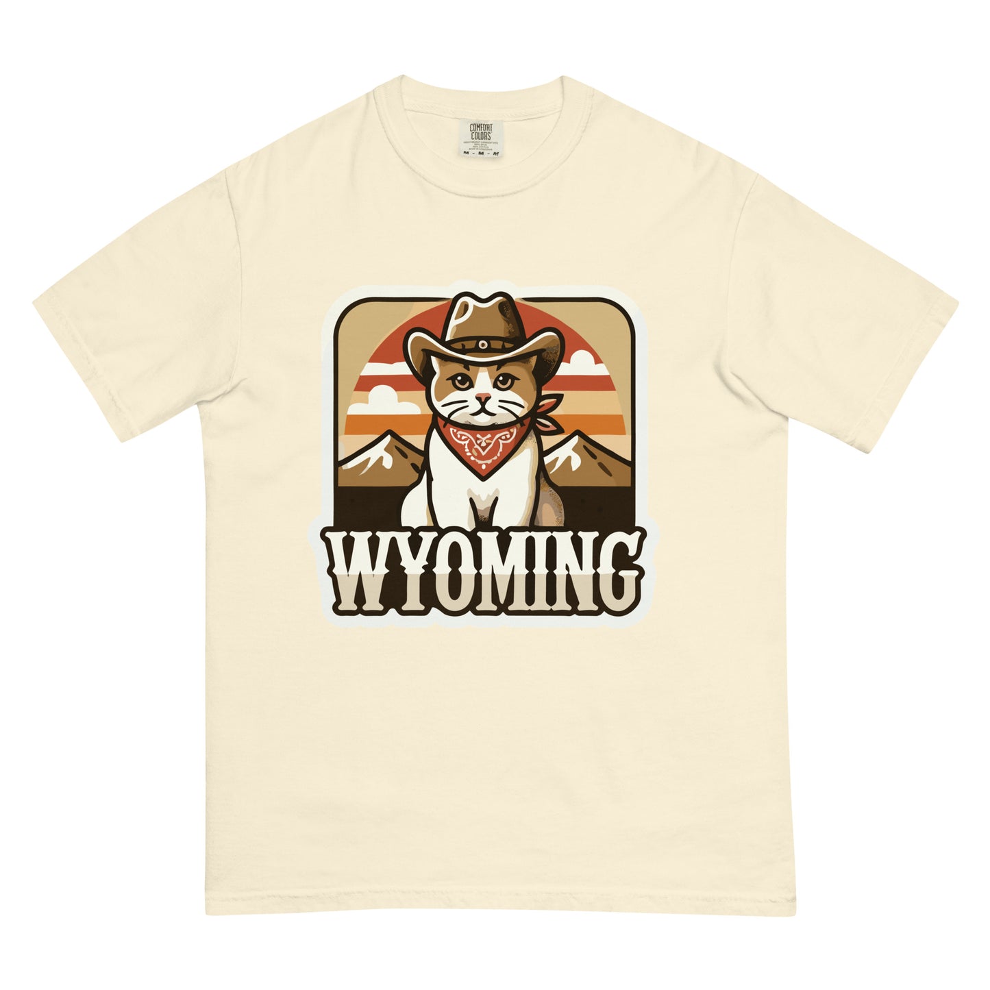 Cream Wyoming cat t-shirt featuring a cat in cowboy hat and bandana with mountain background