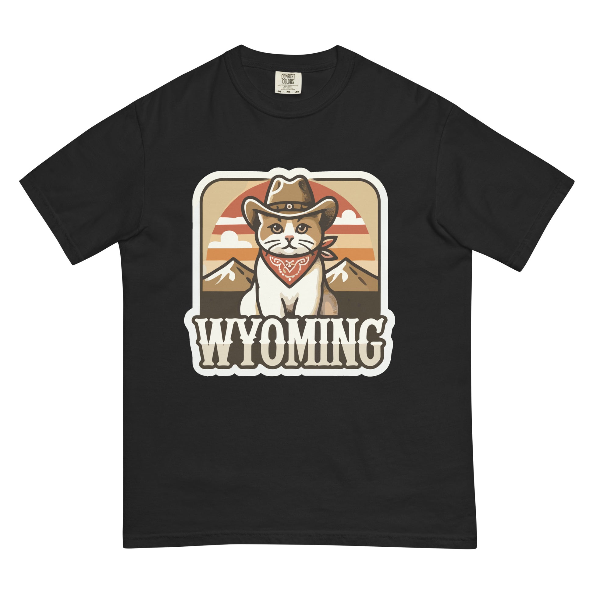 Black Wyoming cat t-shirt with a cartoon cat wearing a cowboy hat and bandana in front of mountains