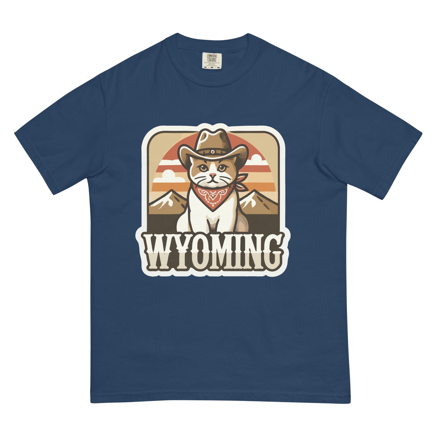Wyoming cat t-shirt featuring a cat in a cowboy hat and bandana with mountain background