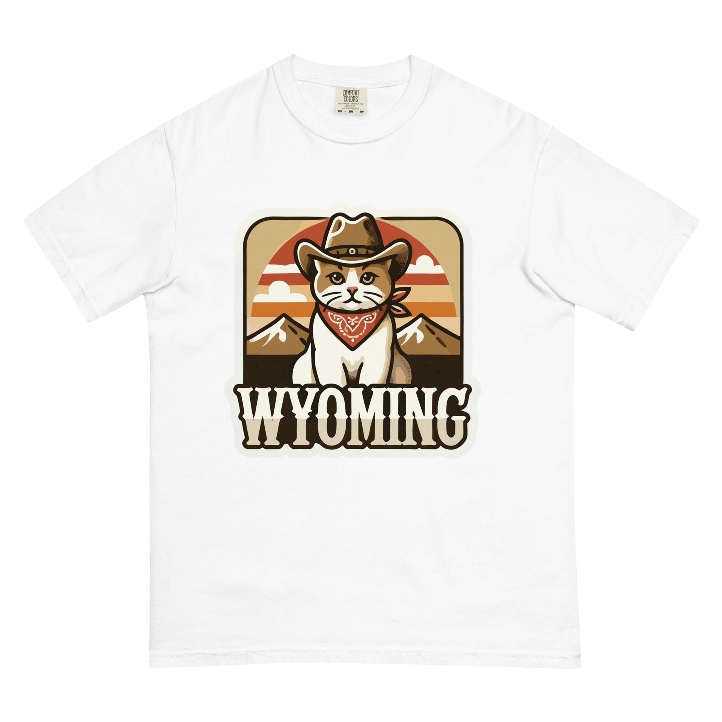 White Wyoming cat t-shirt featuring a cartoon cat wearing a cowboy hat and bandana with mountains background