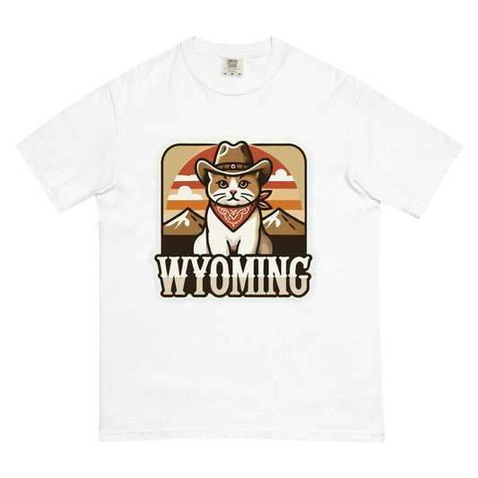 White Wyoming cat t-shirt featuring a cartoon cat wearing a cowboy hat and bandana with mountains background